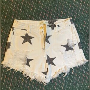 White with black stars ripped Jean shorts